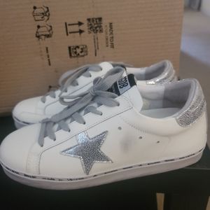 White shoes with silver star
